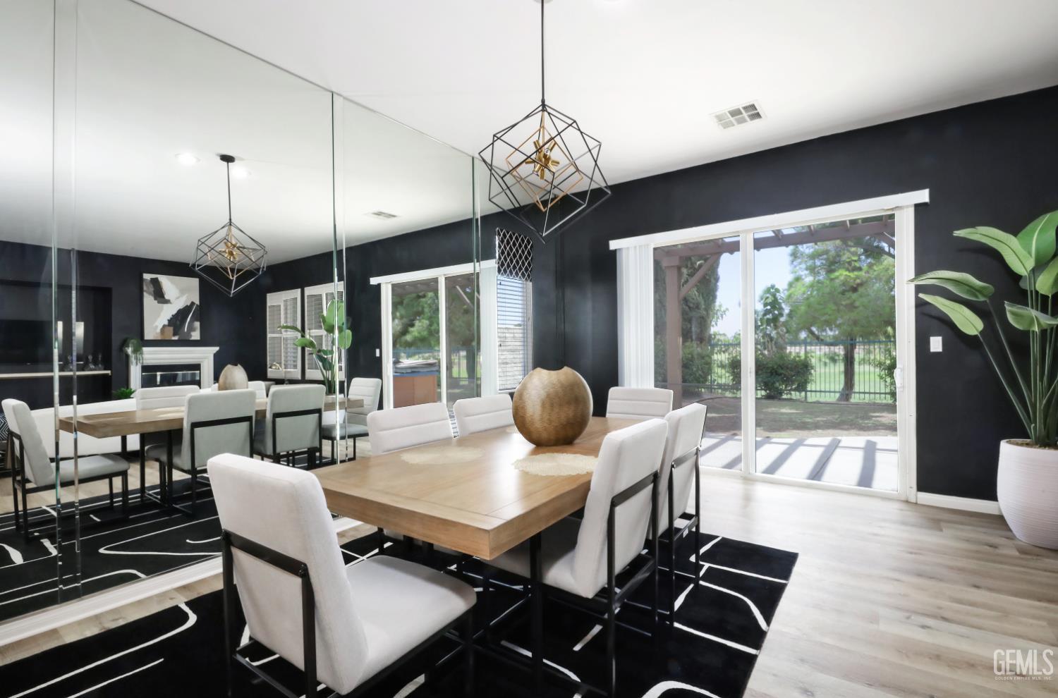 Undisclosed Address Bakersfield, CA 93312 - Photo 14 of 44 a dining room with furniture a chandelier and wooden floor