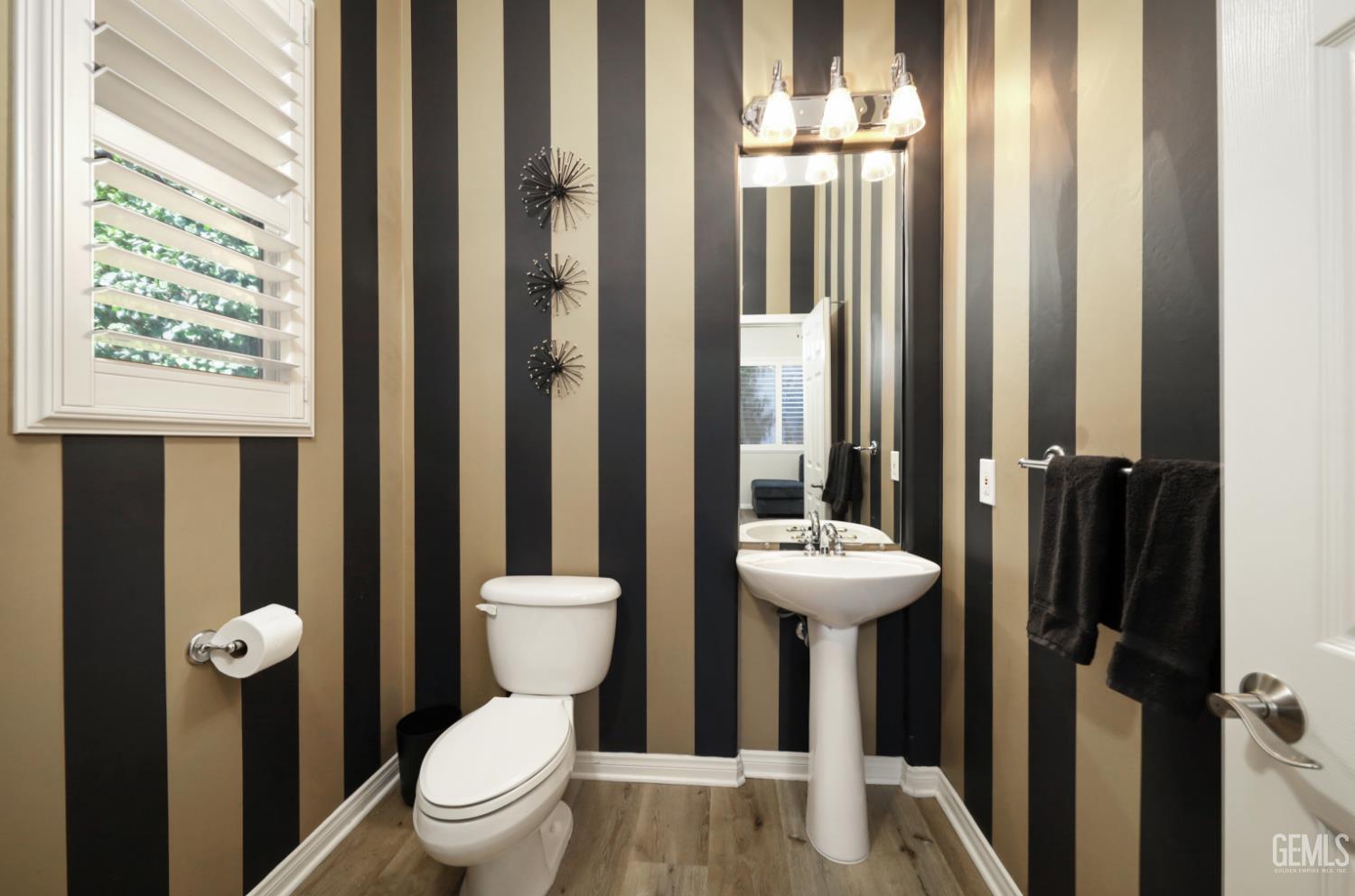 Undisclosed Address Bakersfield, CA 93312 - Photo 15 of 44 a bathroom with a sink a toilet and shower