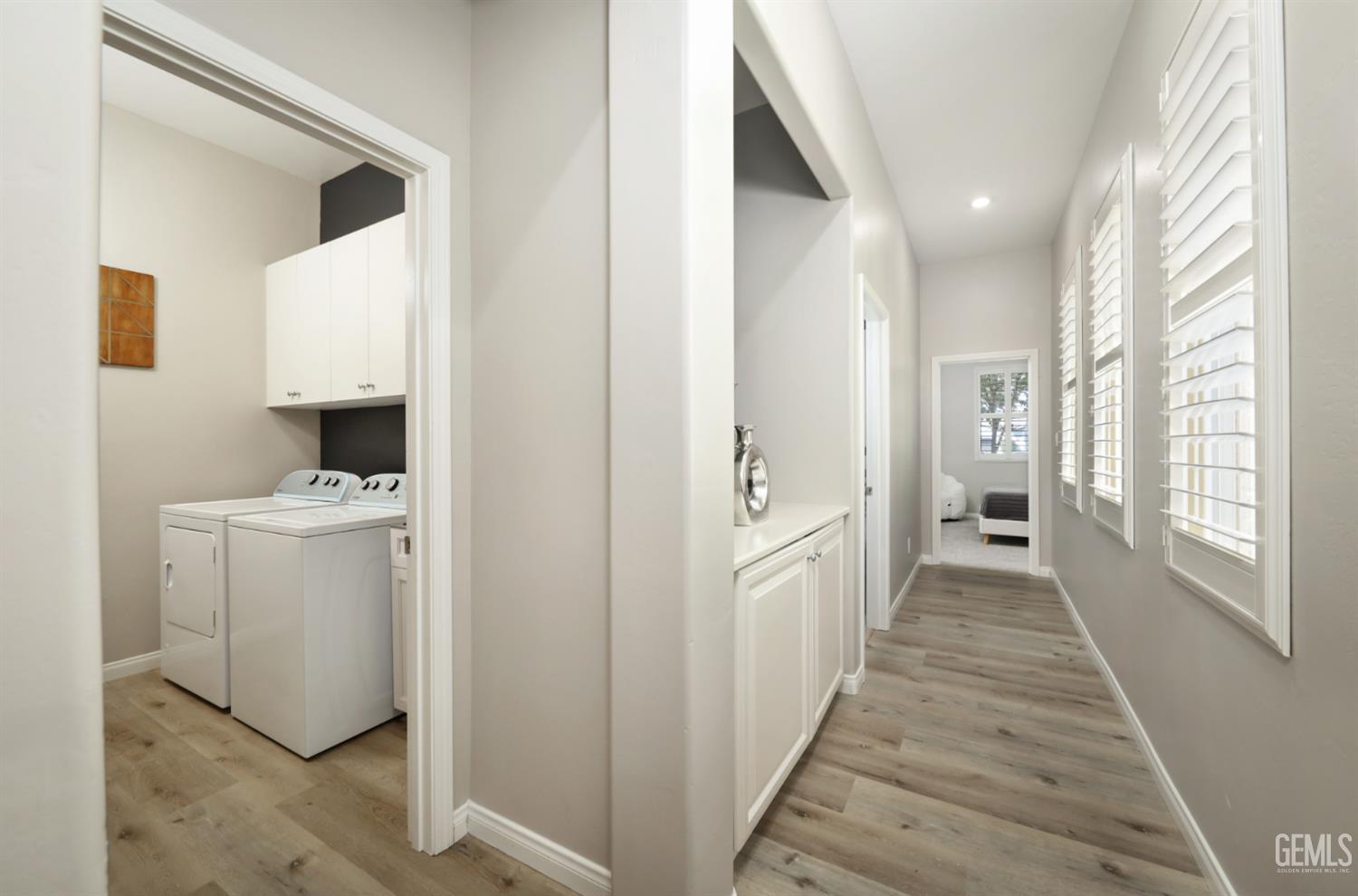 Undisclosed Address Bakersfield, CA 93312 - Photo 16 of 44 a view of hallway with washer and dryer