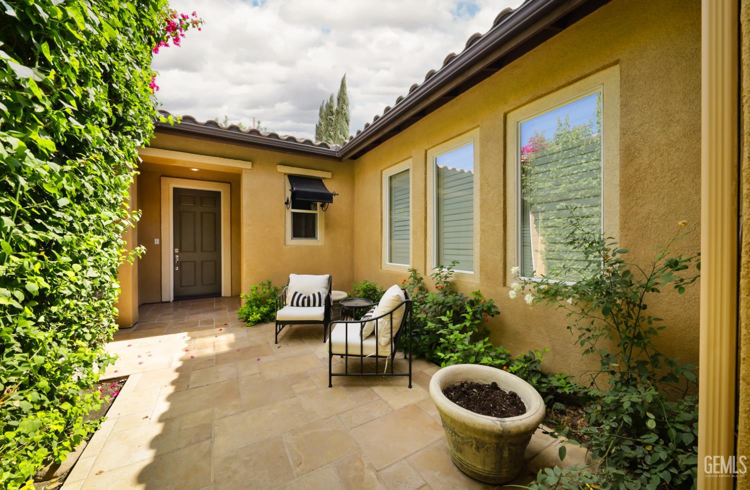 Undisclosed Address Bakersfield, CA 93312 - Photo 26 of 44 a view of a patio with chairs and plants
