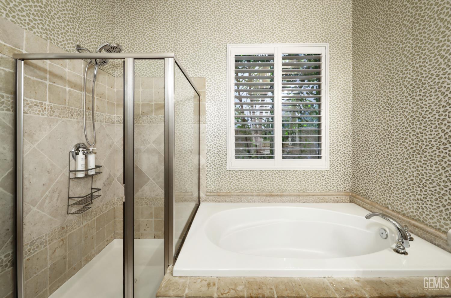 Undisclosed Address Bakersfield, CA 93312 - Photo 36 of 44 a bathroom with a bathtub and shower