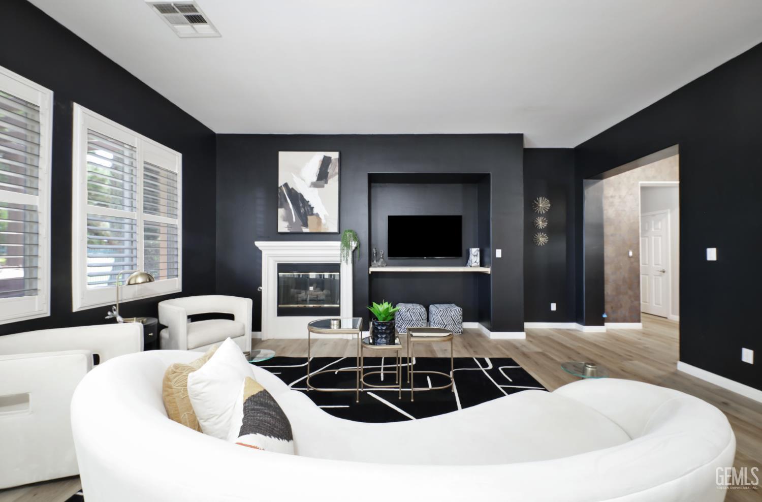 Undisclosed Address Bakersfield, CA 93312 - Photo 4 of 44 a living room with furniture a large window and a flat screen tv