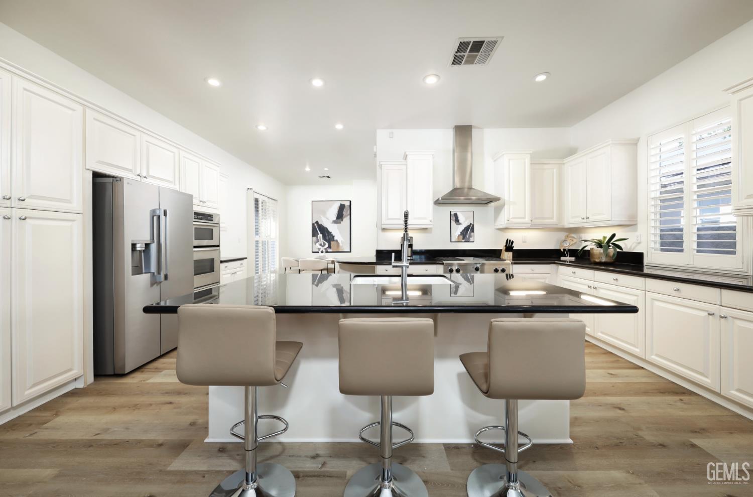 Undisclosed Address Bakersfield, CA 93312 - Photo 7 of 44 a kitchen with stainless steel appliances granite countertop a sink and a refrigerator