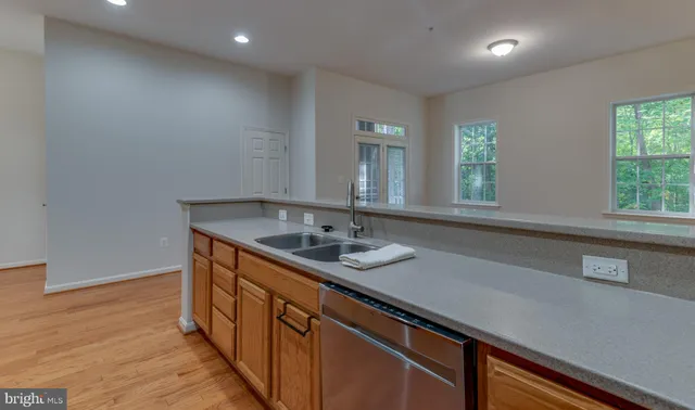 a kitchen with a sink and a window