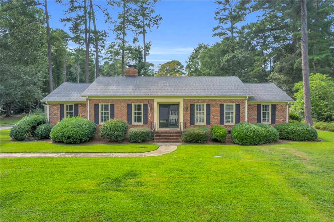 203 Fox Creek Road Anderson, SC 29621 - Photo 35 of 36 Brick facade home featuring classic shutters and a well-manicured lawn awaits new residents.