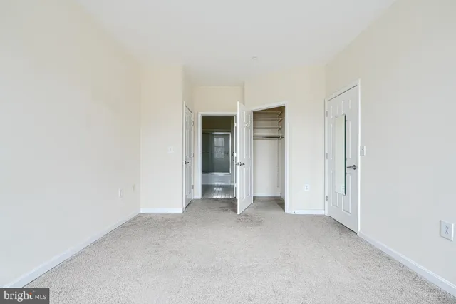 a view of empty room with closet