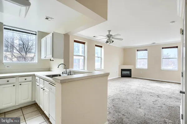 a view of a kitchen counter space and windows