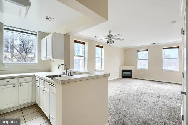 a view of a kitchen counter space and windows