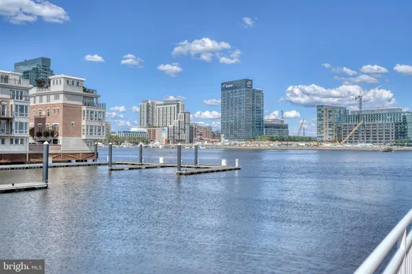 a view of a lake with boats and trees