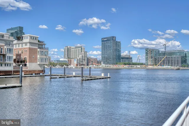 a view of a lake with boats and trees