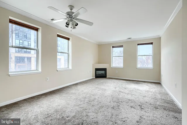 a view of an empty room with a window