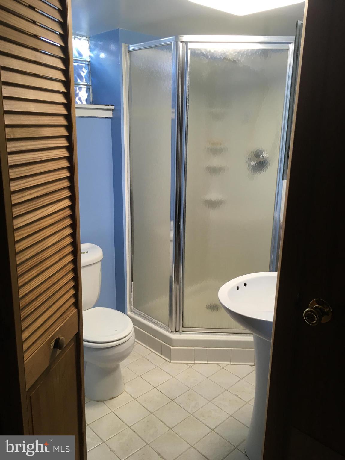 8103 Edwill Avenue Rosedale, MD 21237 - Photo 24 of 31 a bathroom with a toilet and a shower