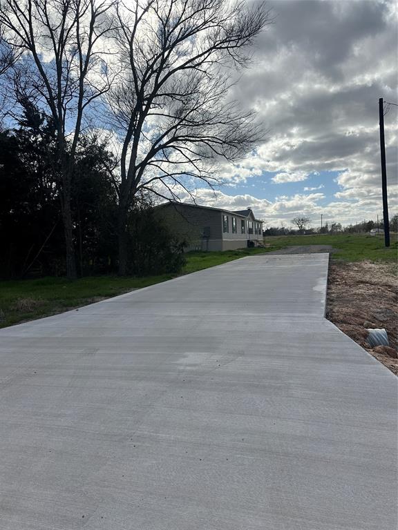 230 Largo Street Bonham, TX 75418 - Photo 15 of 34 a view of a terrace with yard