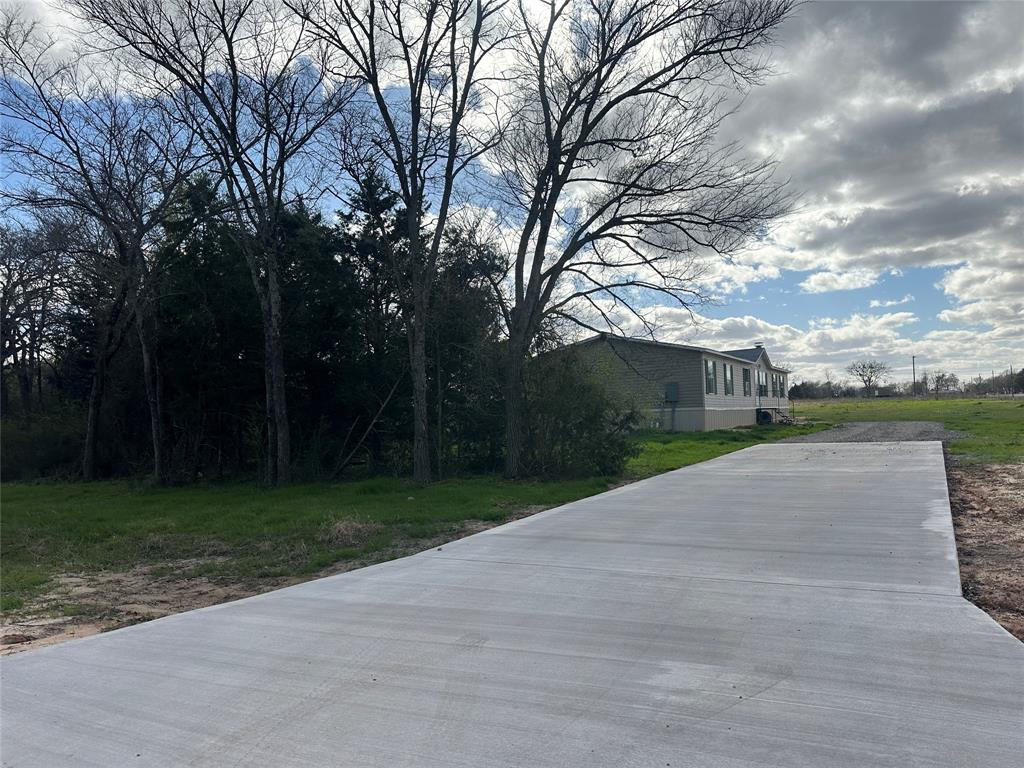230 Largo Street Bonham, TX 75418 - Photo 16 of 34 a view of a park with plants and trees