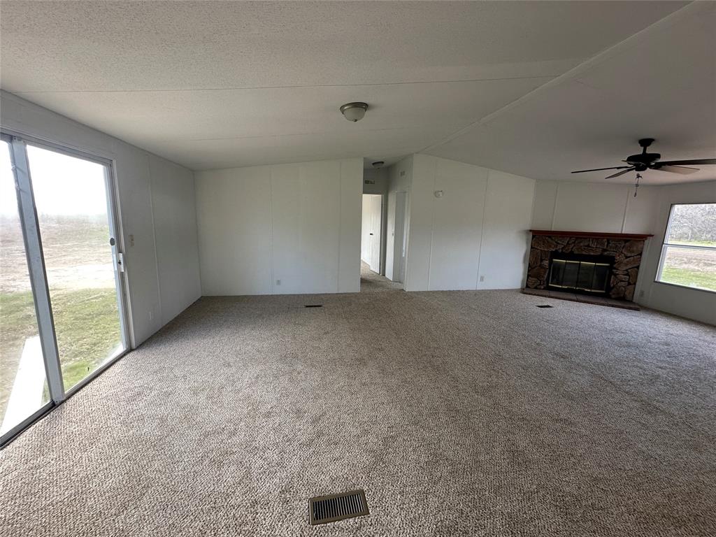 230 Largo Street Bonham, TX 75418 - Photo 19 of 34 a view of a livingroom with a fireplace