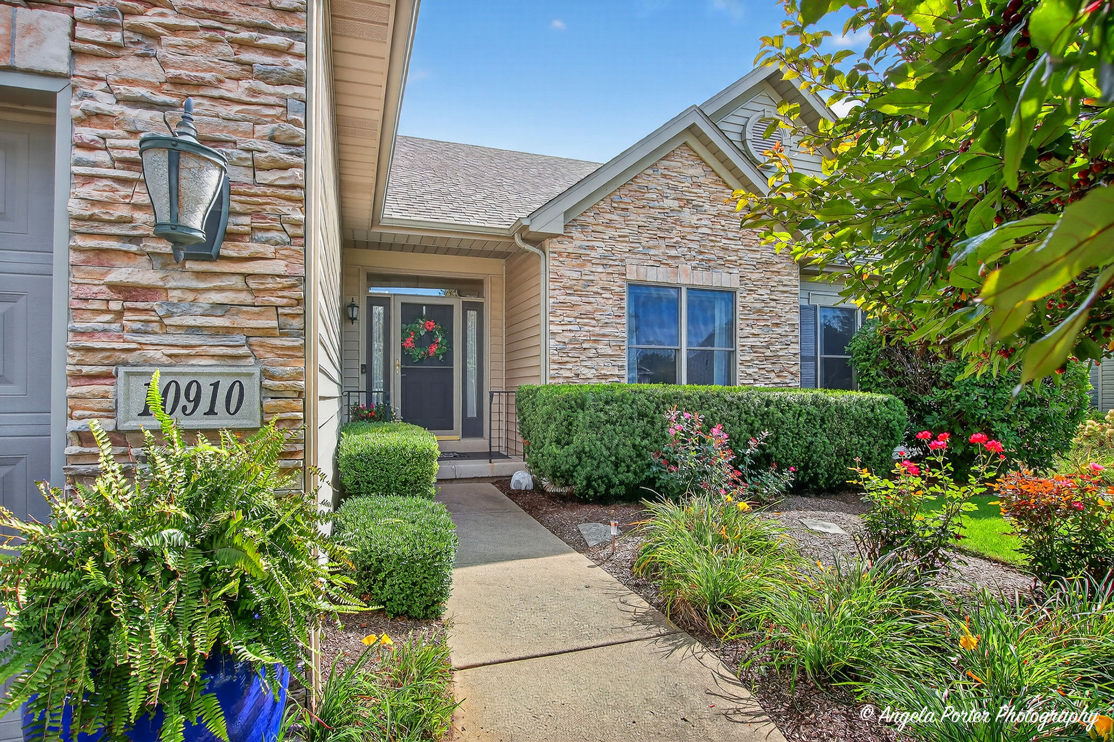 a front view of a house with garden