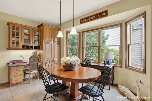 a kitchen with stainless steel appliances granite countertop wooden cabinets a stove a sink and a granite counter top