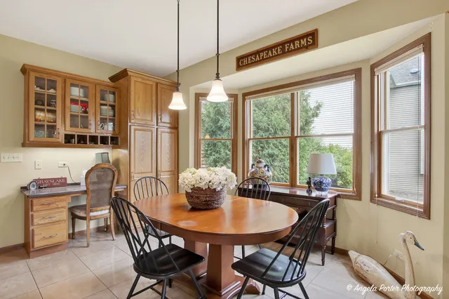 a kitchen with stainless steel appliances granite countertop wooden cabinets a stove a sink and a granite counter top