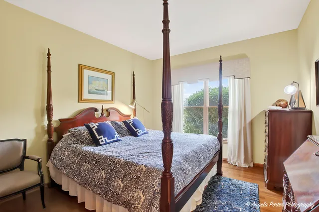 a living room with a flat screen tv and floor to ceiling window