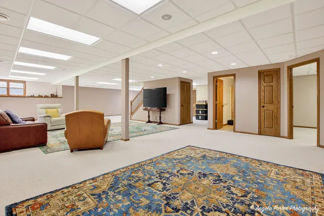 a view of a livingroom with furniture and a flat screen tv