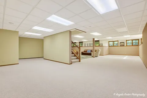 a dining room with furniture window and wooden floor