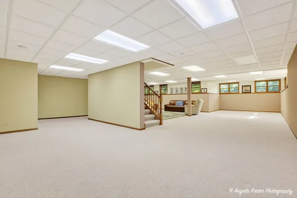 a dining room with furniture window and wooden floor