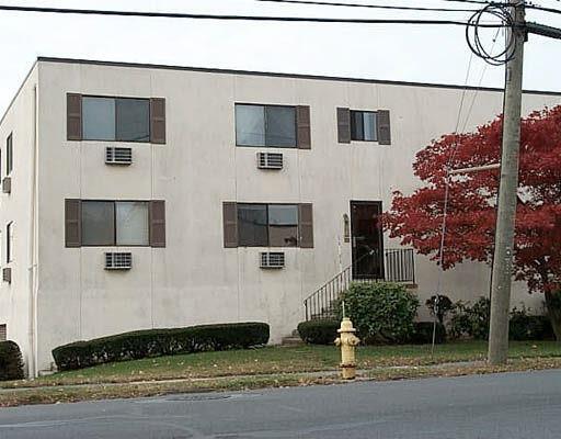 735 Cove Road, Unit D2 Stamford, CT 06902 - Photo 1 of 1 a front view of a house with a yard and garage