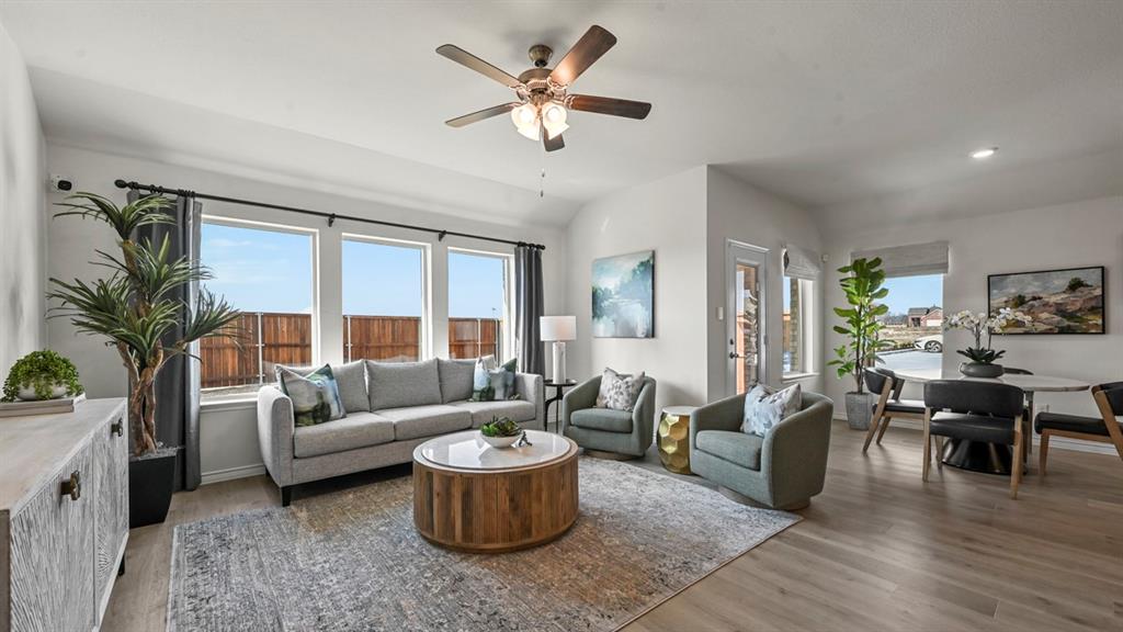 4020 Red Blf Street Pilot Point, TX 76258 - Photo 31 of 39 a living room with furniture potted plant and a large window