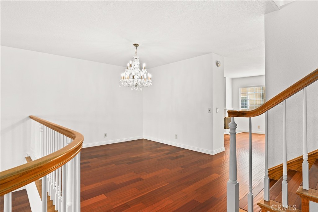 2300 Maple Avenue, Unit 26 Torrance, CA 90503 - Photo 11 of 24 a view of a hallway with wooden floor and staircase