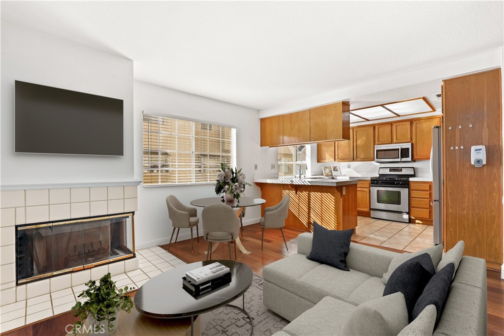 2300 Maple Avenue, Unit 26 Torrance, CA 90503 - Photo 2 of 30 a living room with furniture and a flat screen tv