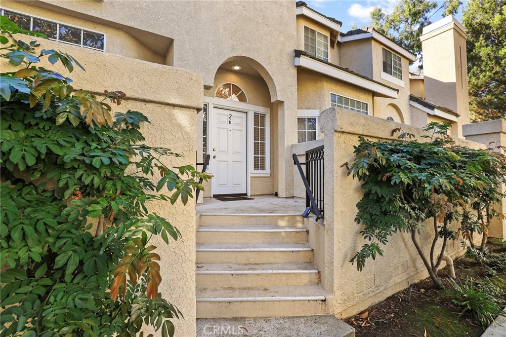 2300 Maple Avenue, Unit 26 Torrance, CA 90503 - Photo 4 of 24 a front view of a house with a garden and plants