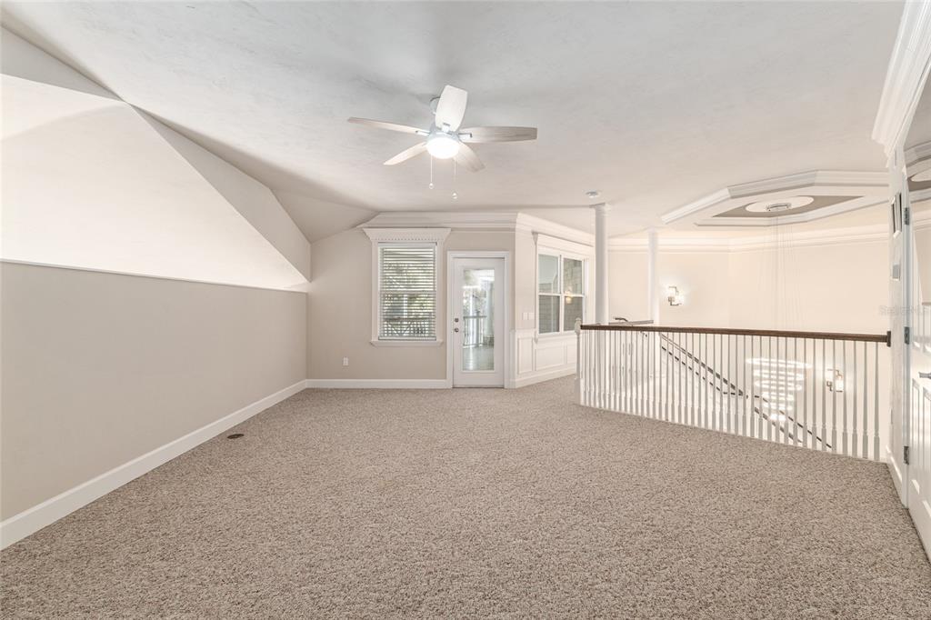 10614 Southwest 15th Lane Gainesville, FL 32607 - Photo 49 of 85 an empty room with windows and fan