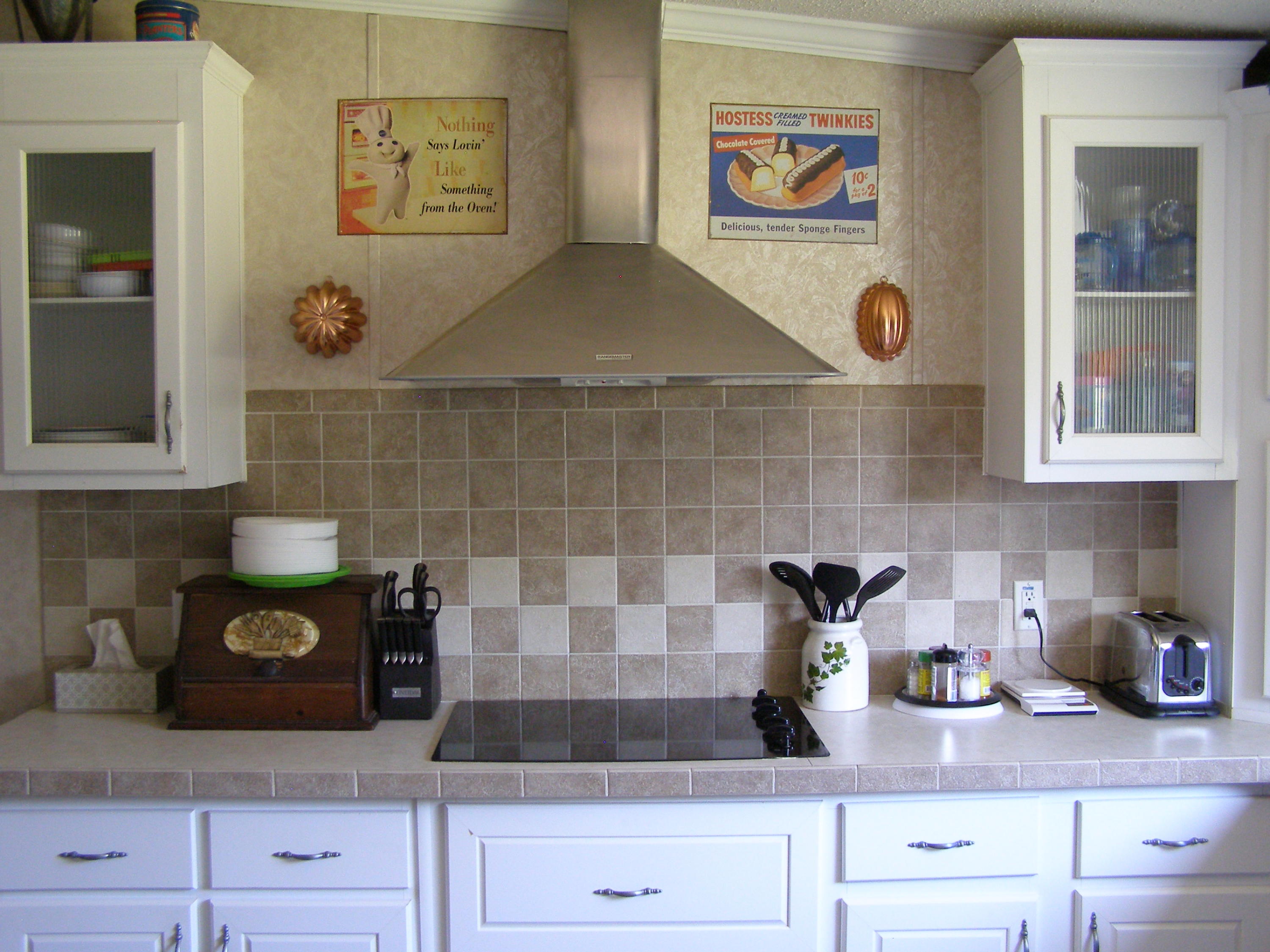1121 State Line Road Baker, FL 32531 - Photo 14 of 25 a kitchen with stainless steel appliances granite countertop a sink and cabinets