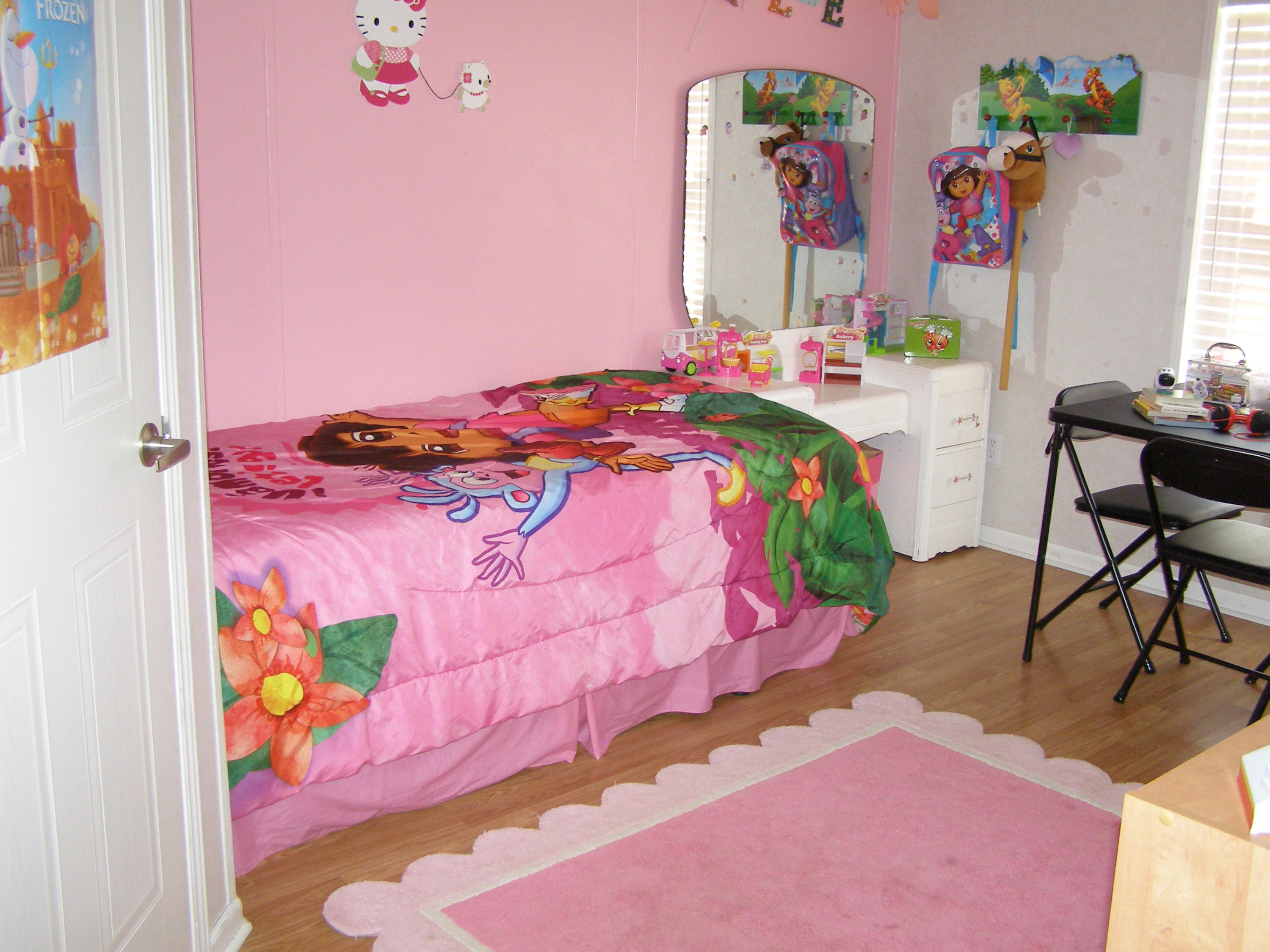 1121 State Line Road Baker, FL 32531 - Photo 20 of 25 a bedroom with a bed and a couch
