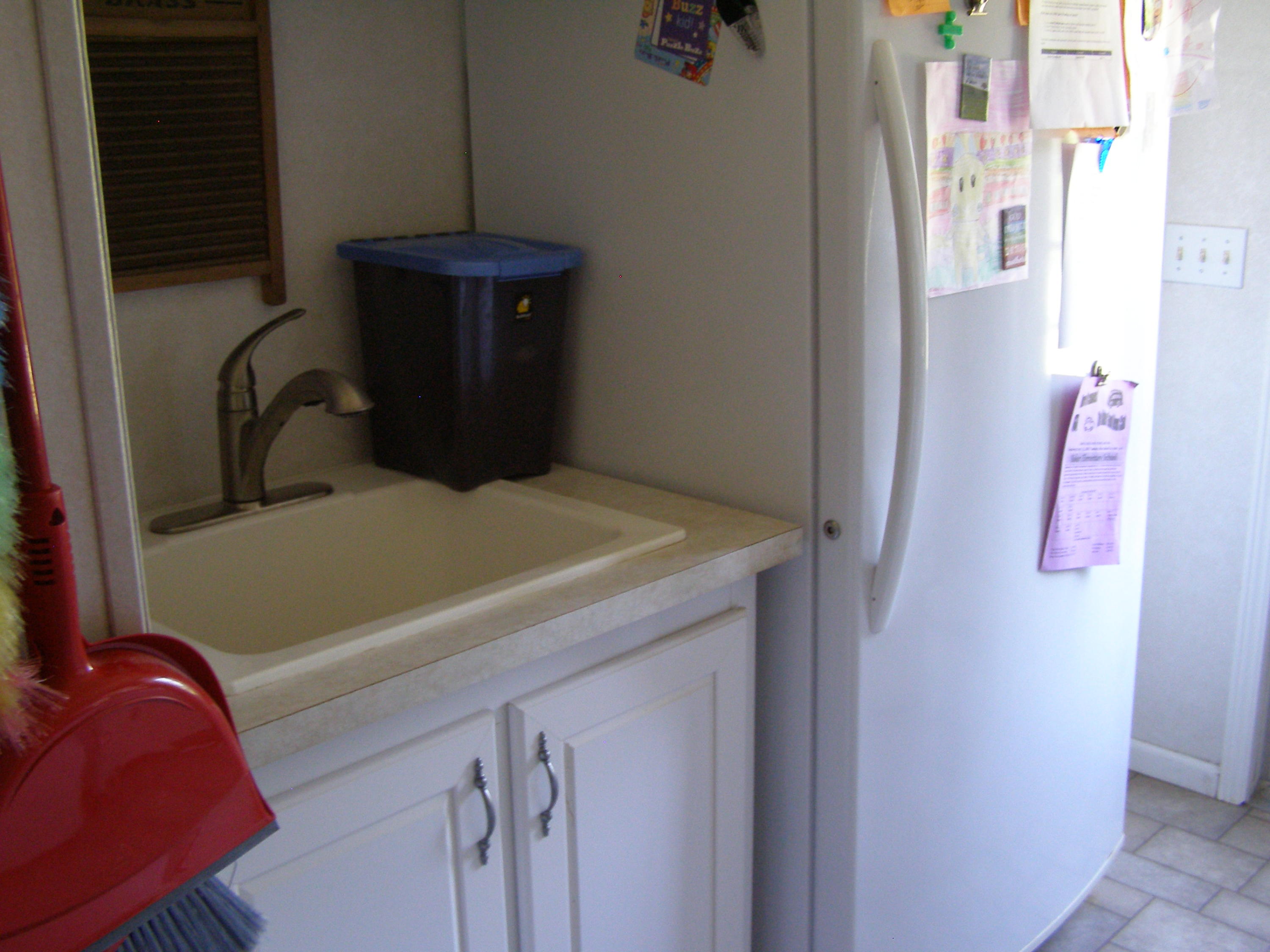 1121 State Line Road Baker, FL 32531 - Photo 24 of 25 a bathroom with a sink and a mirror