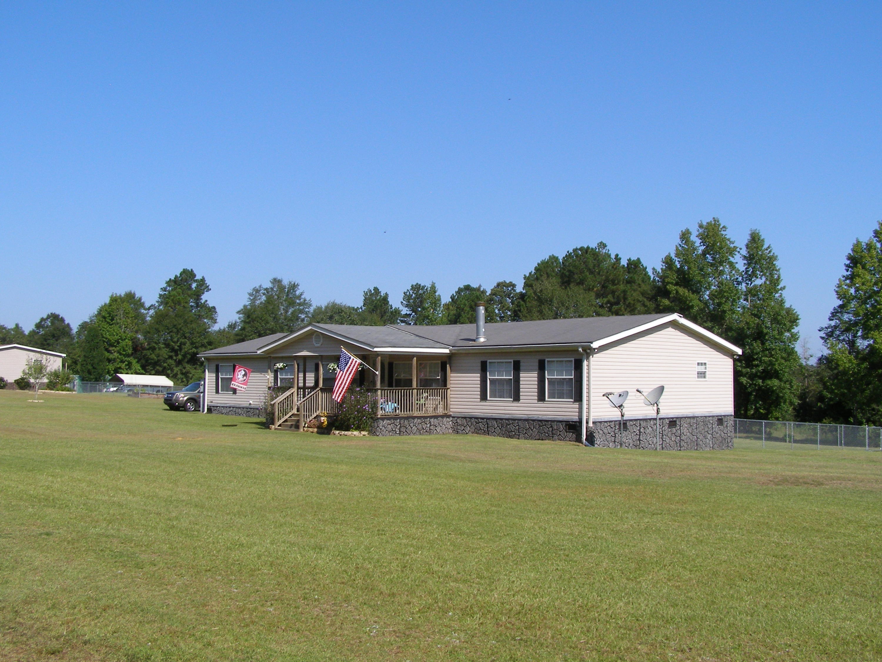 1121 State Line Road Baker, FL 32531 - Photo 3 of 25 a house view with a garden space