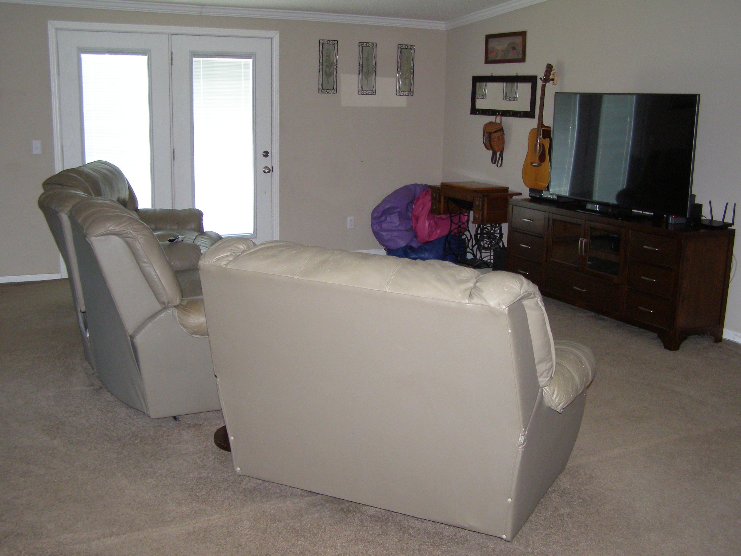 1121 State Line Road Baker, FL 32531 - Photo 7 of 25 a bedroom with a bed and a flat screen tv