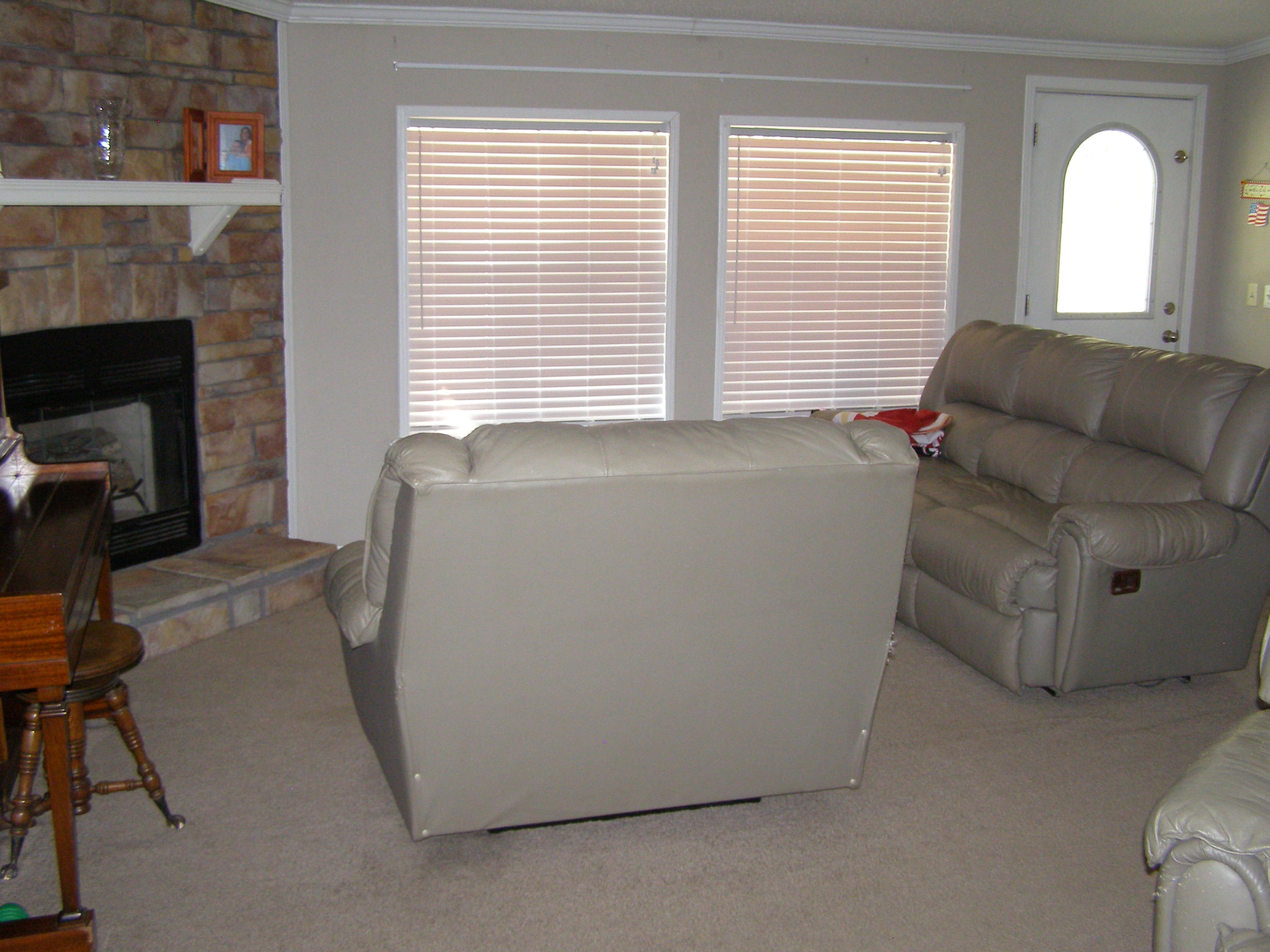 1121 State Line Road Baker, FL 32531 - Photo 8 of 25 a living room with furniture and a fireplace
