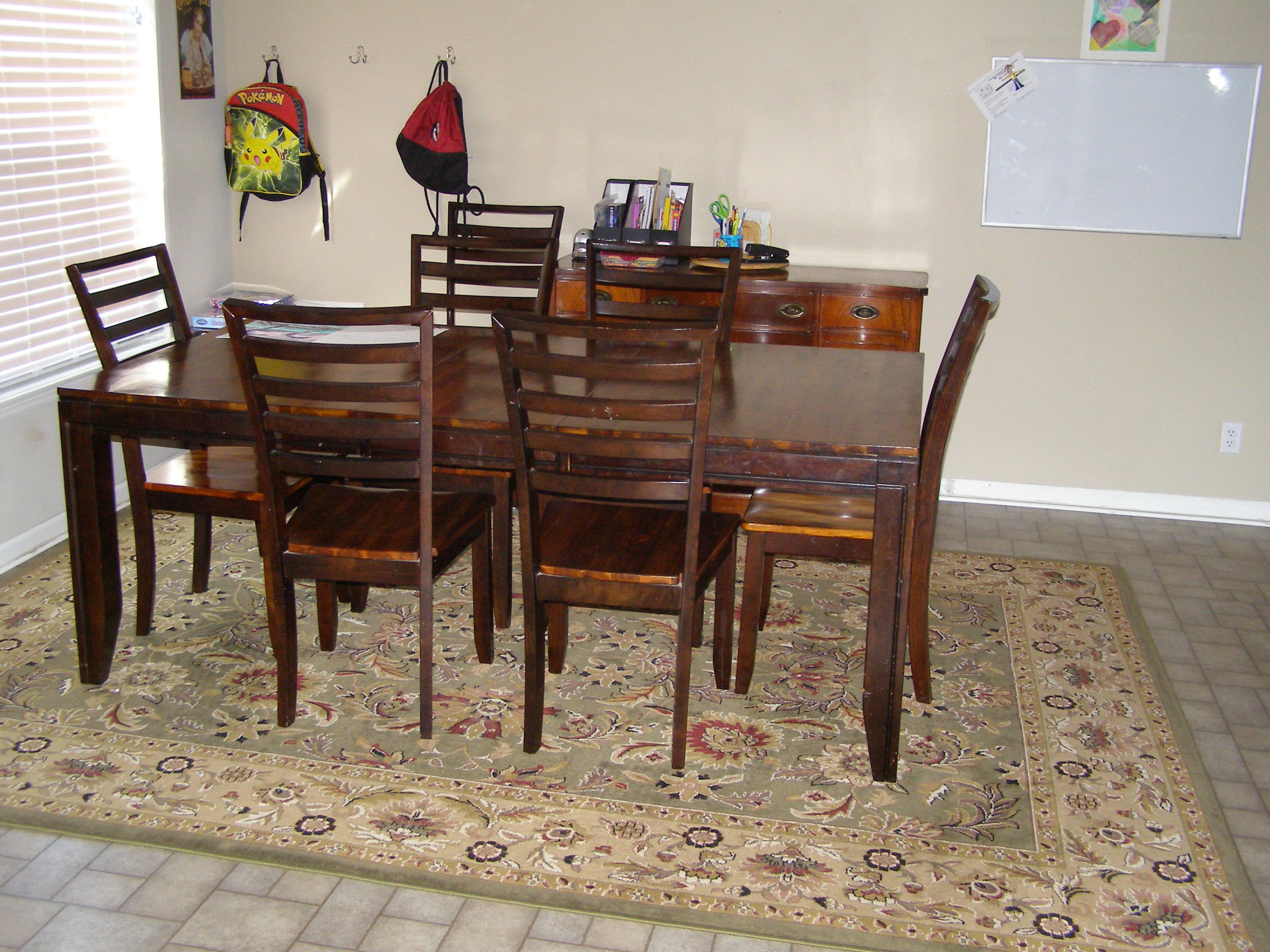 1121 State Line Road Baker, FL 32531 - Photo 10 of 25 a view of a dining room with furniture