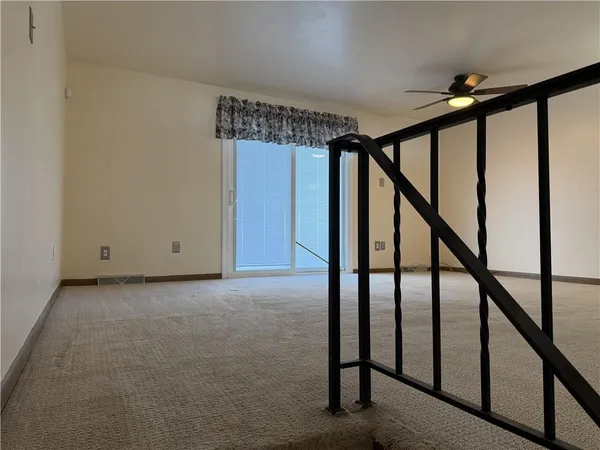 a view of a hallway with workspace and mirror in it