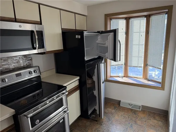 a view of a glass door with a living room