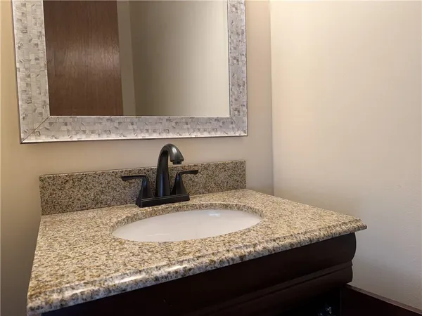 a white toilet sitting next to a sink
