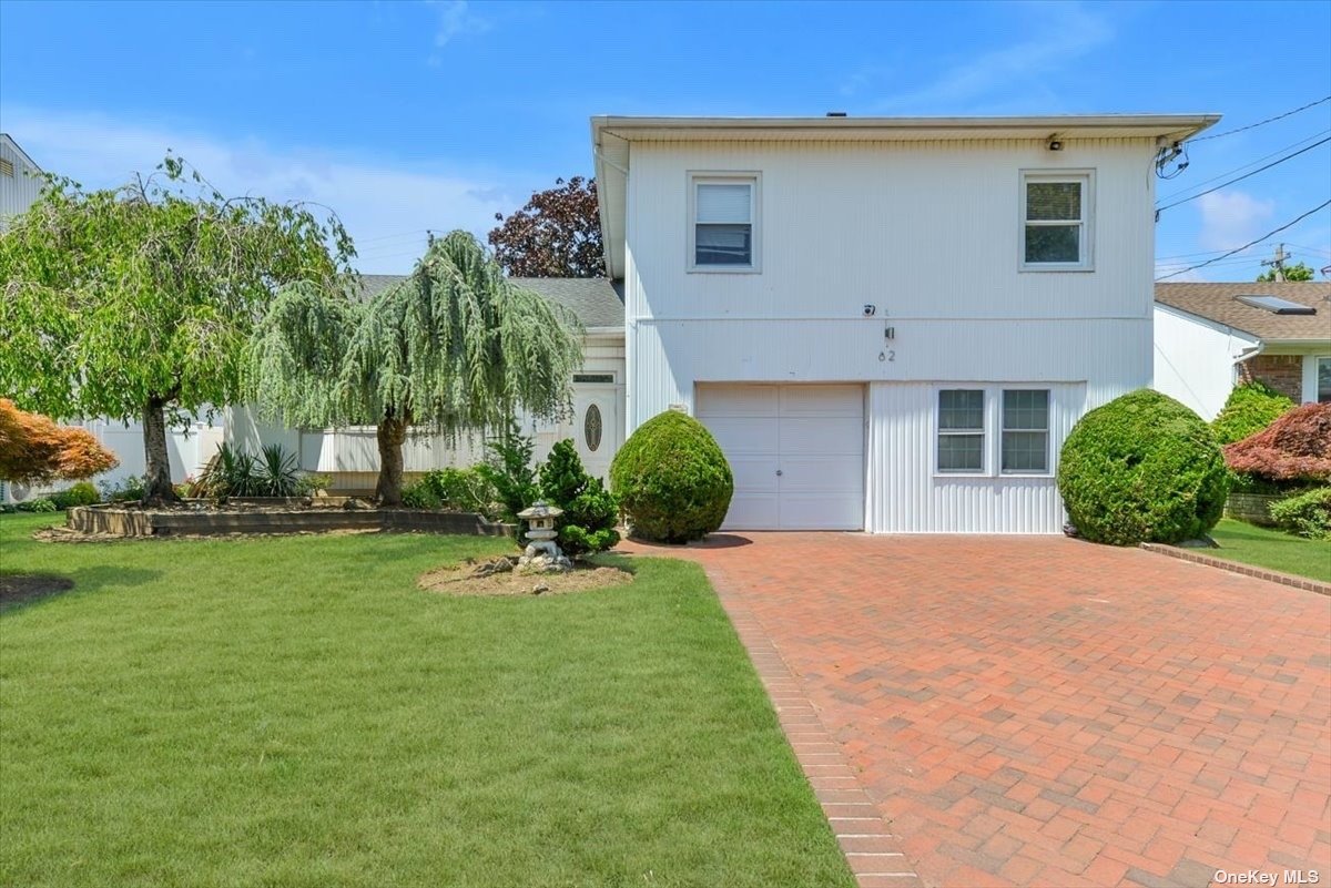 62 Halyard Road Valley Stream, NY 11581 - Photo 1 of 1 a front view of a house with a yard
