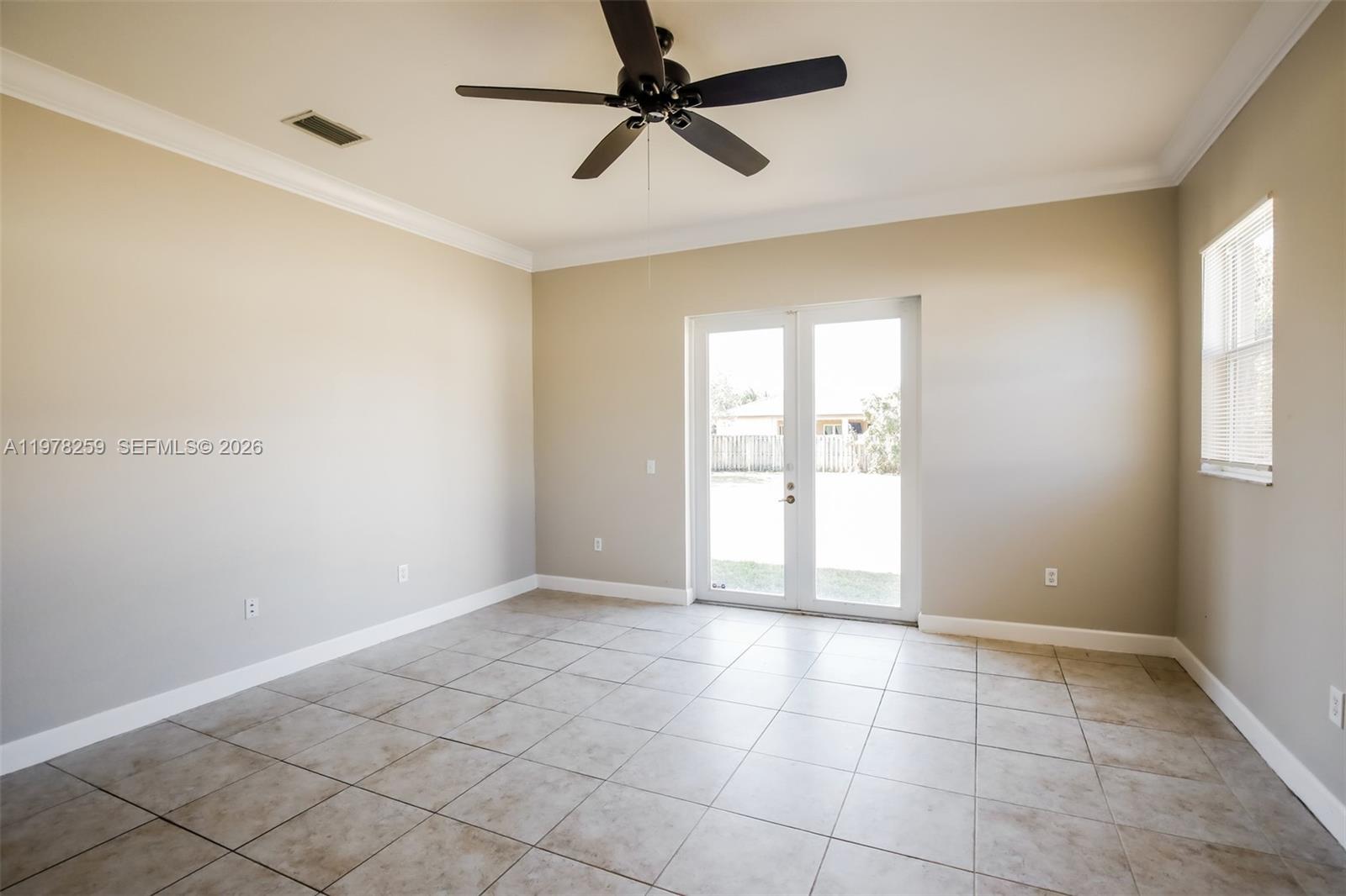 18686 Southwest 132nd Avenue Miami, FL 33177 - Photo 10 of 18 a view of an empty room and window
