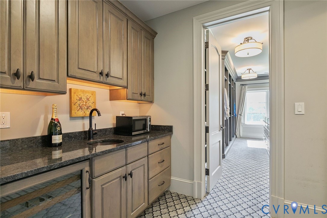 785 Oak Spring Lane Manakin-Sabot, VA 23103 - Photo 44 of 96 Wet bar in primary with
copper sink, cabinets wi
