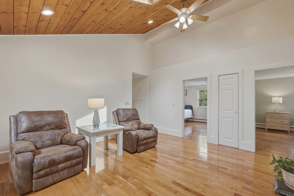 90 Rounsevell Road Tewksbury, MA 01876 - Photo 16 of 42 a living room with furniture and a wooden floor