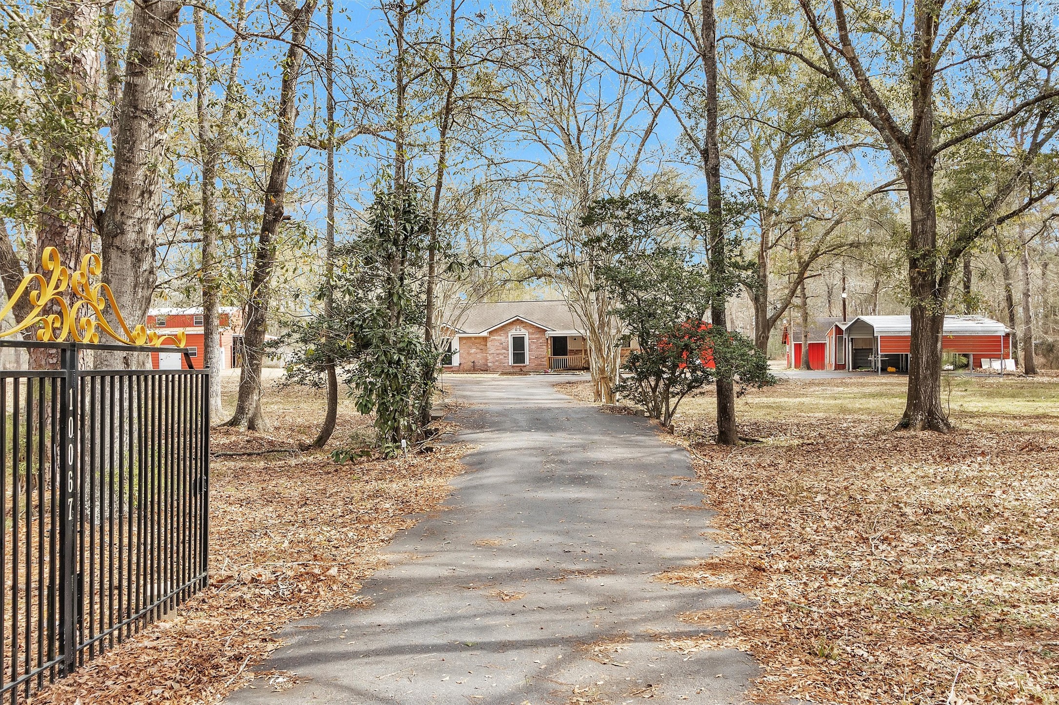 10067 White Rock Road Conroe, TX 77306 - Photo 2 of 46 a view of road and trees