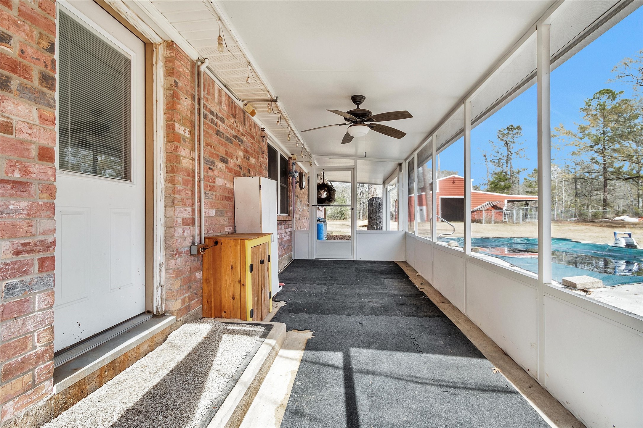 10067 White Rock Road Conroe, TX 77306 - Photo 36 of 46 a view of a porch with wooden floor and windows