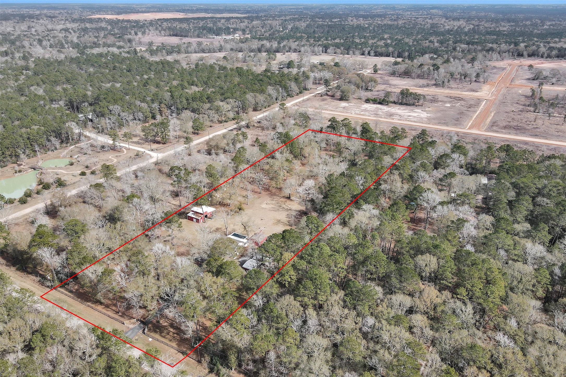 10067 White Rock Road Conroe, TX 77306 - Photo 45 of 46 an aerial view of residential houses with outdoor space and trees