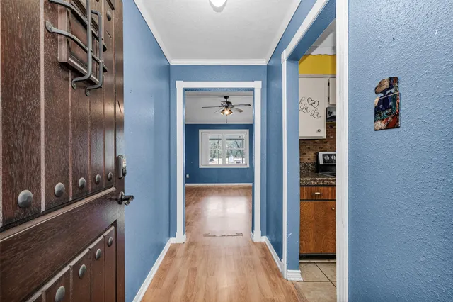 a view of a hallway view with wooden floor and staircase